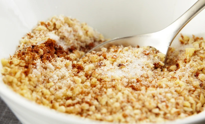 a bowl filled with a mixture of powdered sugar