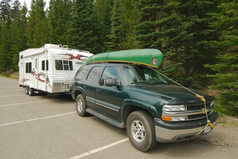 an rv truck is parked next to a camper