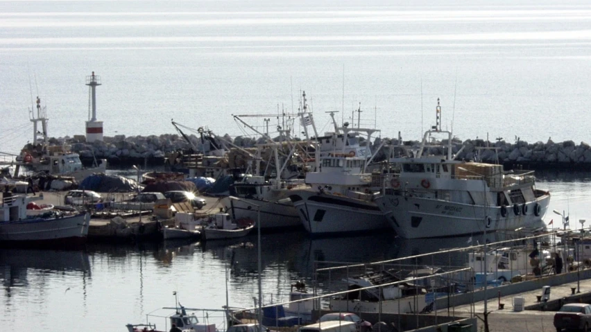 a bunch of boats are tied to a dock