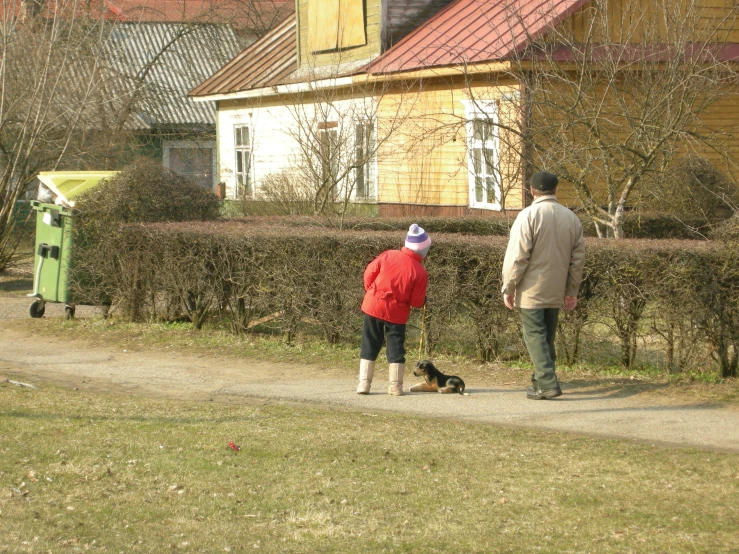 the dog is on a leash with his owner