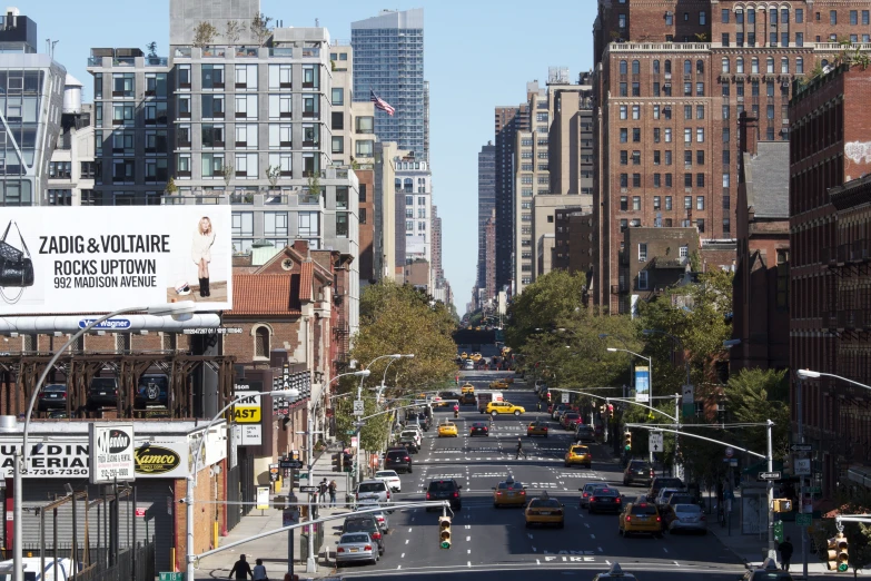 a city street with skyscrs and cars on both sides