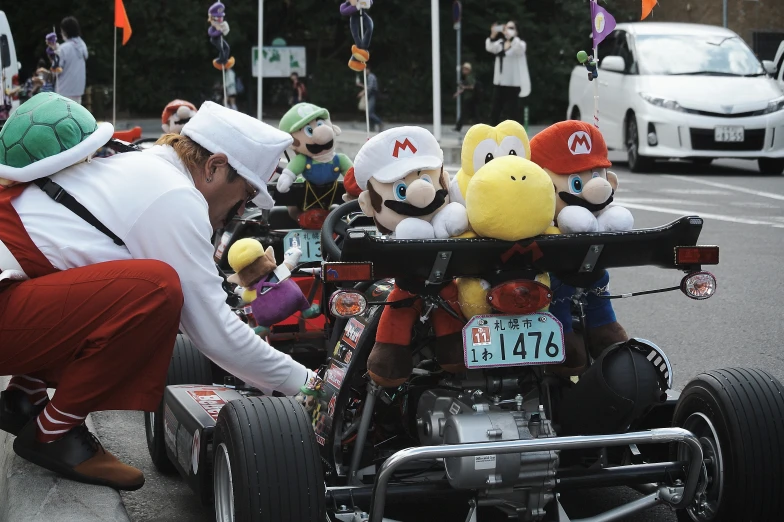 a man is trying to h the toy cart