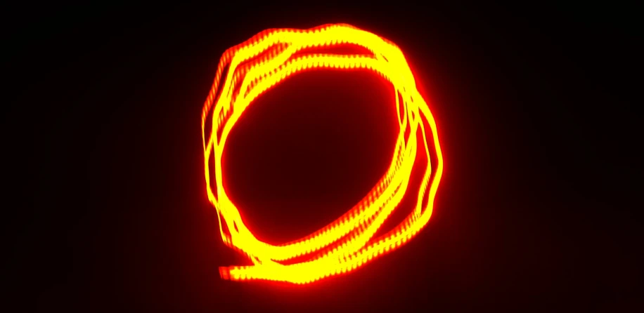 a circle made of lights on top of a black surface