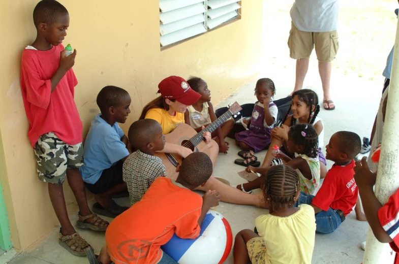 a group of s sit around talking to each other