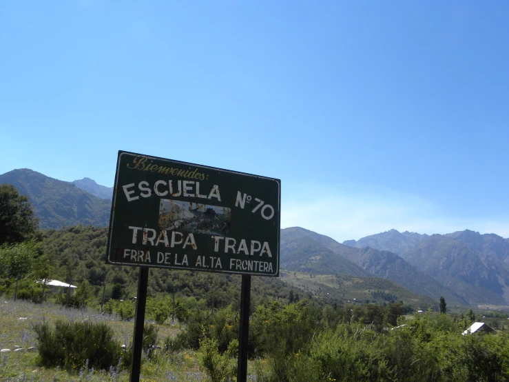 this is a sign at the bottom of a mountain