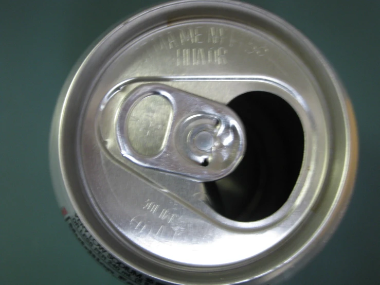 a can with a piece of paper sticking out of it