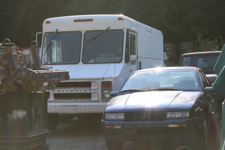 a delivery truck and car stuck in traffic