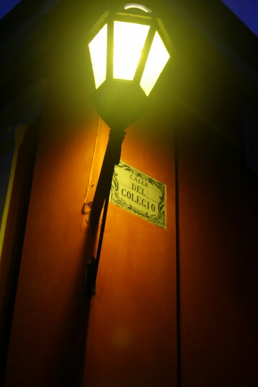 a street light is shining brightly at night