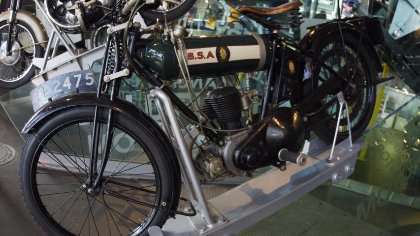 a vintage motorcycle displayed in a museum display