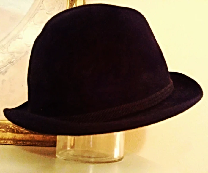 a black hat sitting on top of a counter