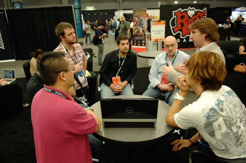 a group of men and women having a conversation