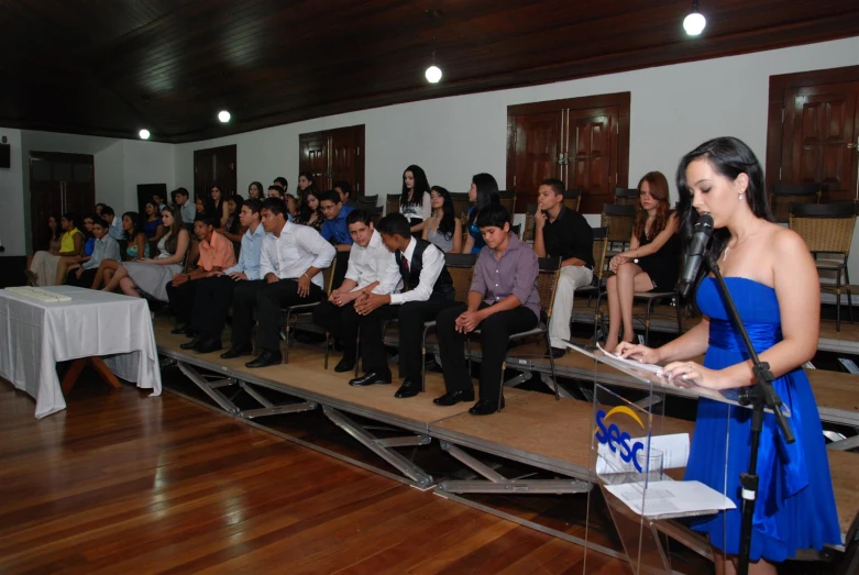 the audience in front of a speaker at an event