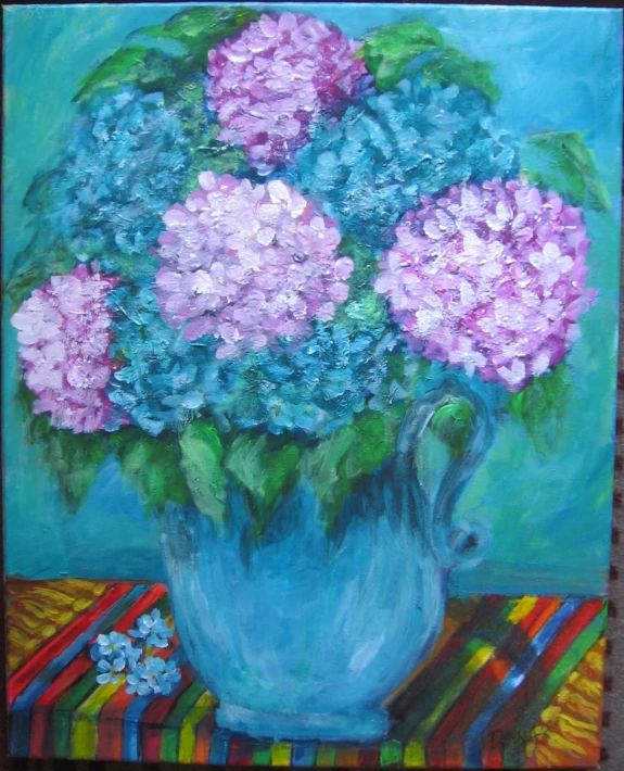 painting of pink and blue flowers in a vase on a striped tablecloth