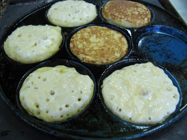 an image of pancakes being cooked in set
