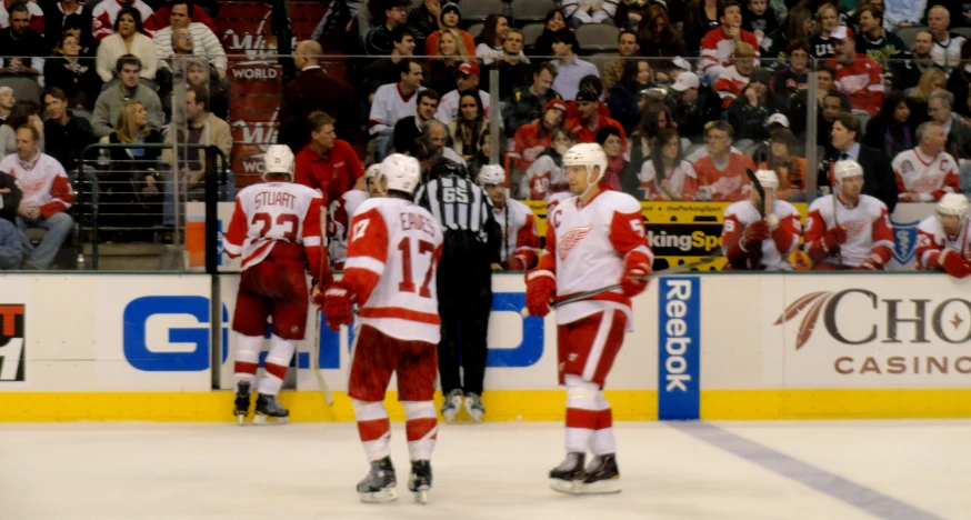 several hockey players on a ice rink at a game