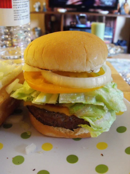 a sandwich with cheese and lettuce, on a plate