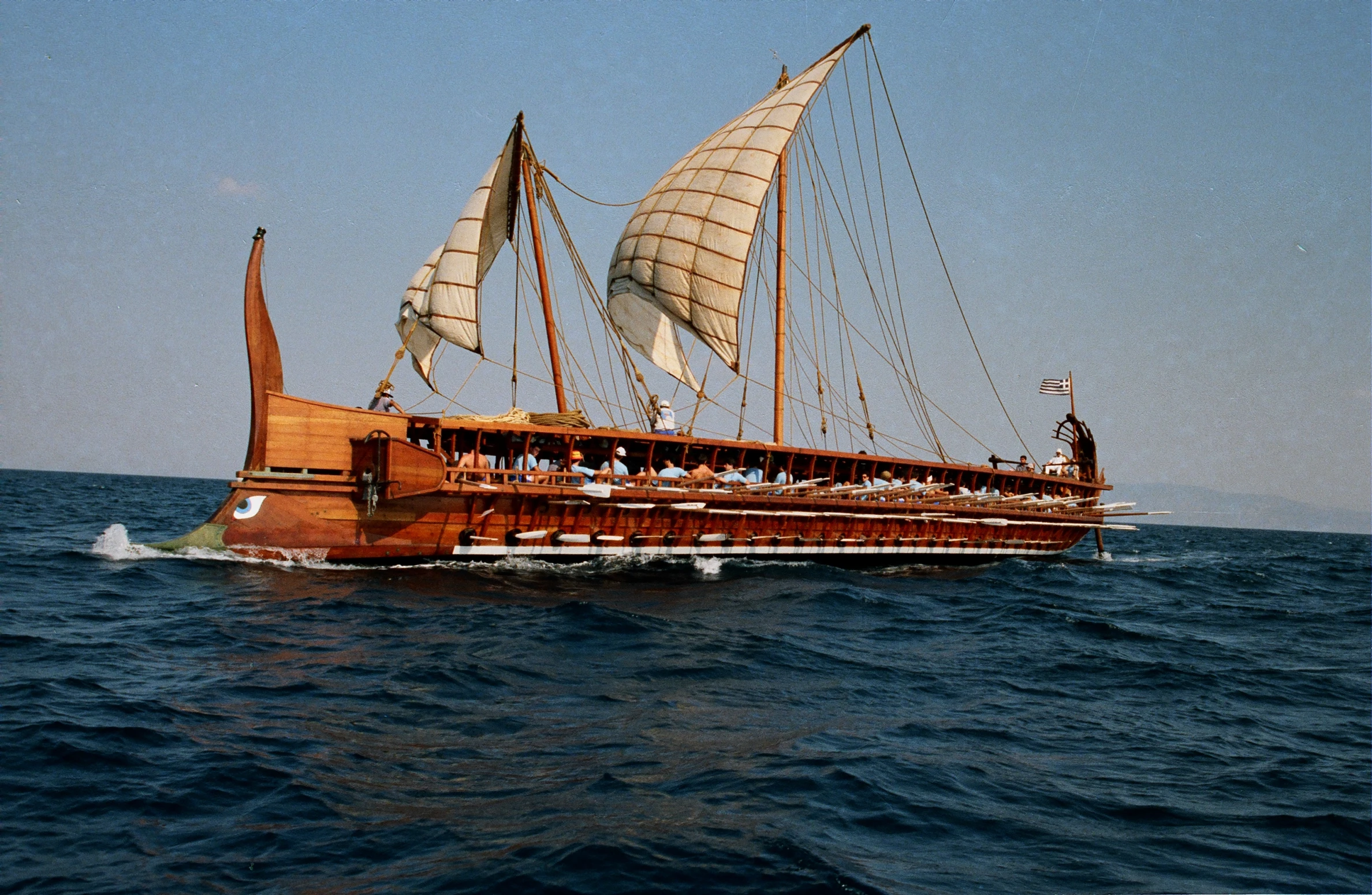 a boat is floating on the open ocean