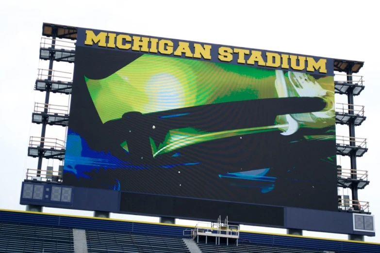 a stadium has a large screen and lights