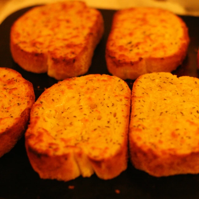 a row of small sandwiches that have been cooked
