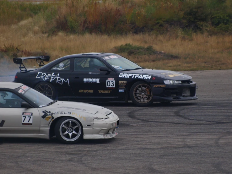 two cars with different exhaust effects next to each other