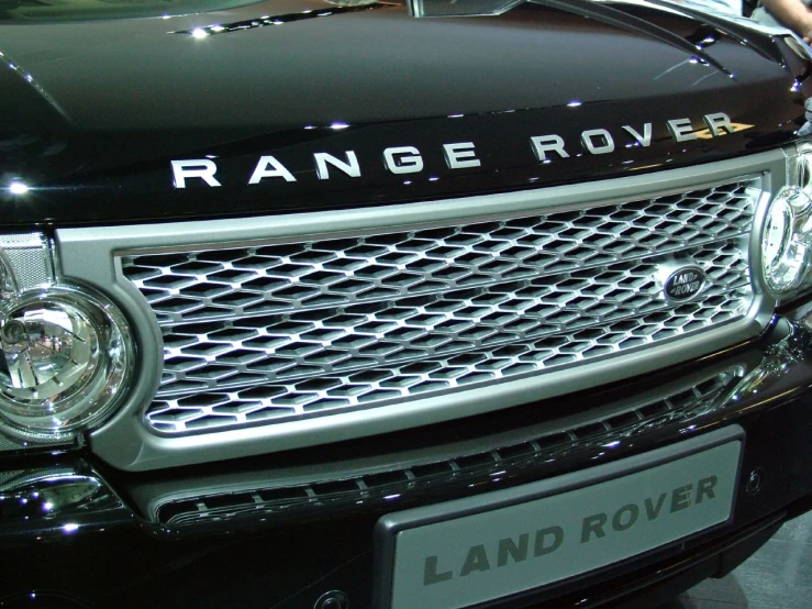 a range rover is parked in a show room