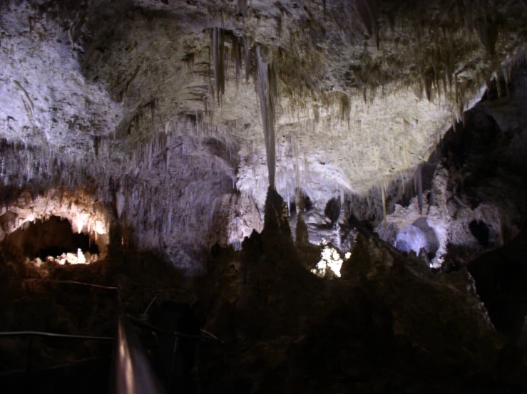 an artistic view of some kind of caves in the wilderness