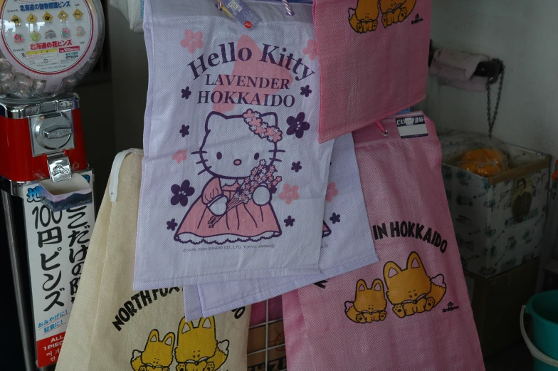 hello kitty towels hanging on the line of machines