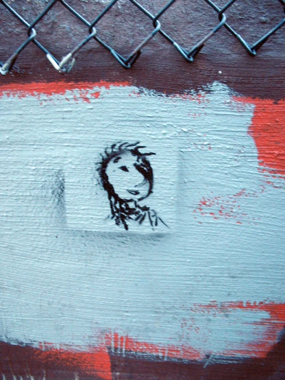 a close up of a piece of graffiti on a wall