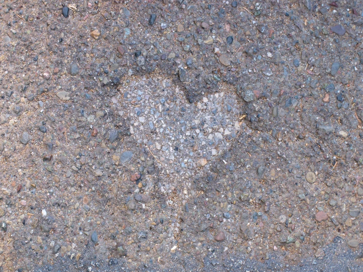 the cement is filled with rocks and pebbles