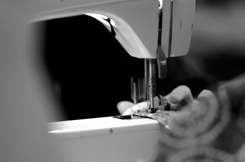 a woman sewing soing on a machine