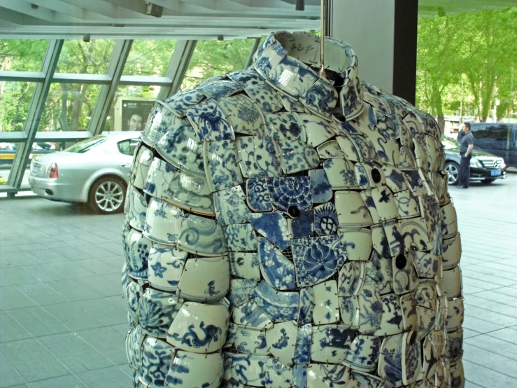 a blue and white shirt on display at a store