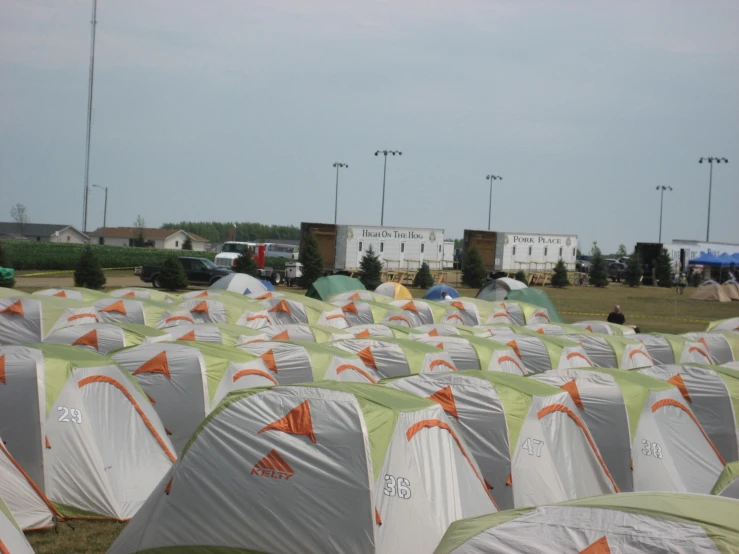 a large group of tents sitting next to a road