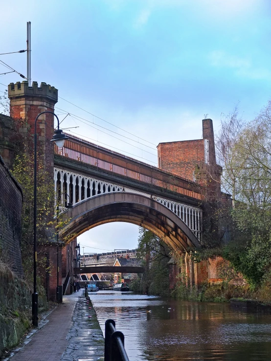 an old bridge crossing the water underneath it