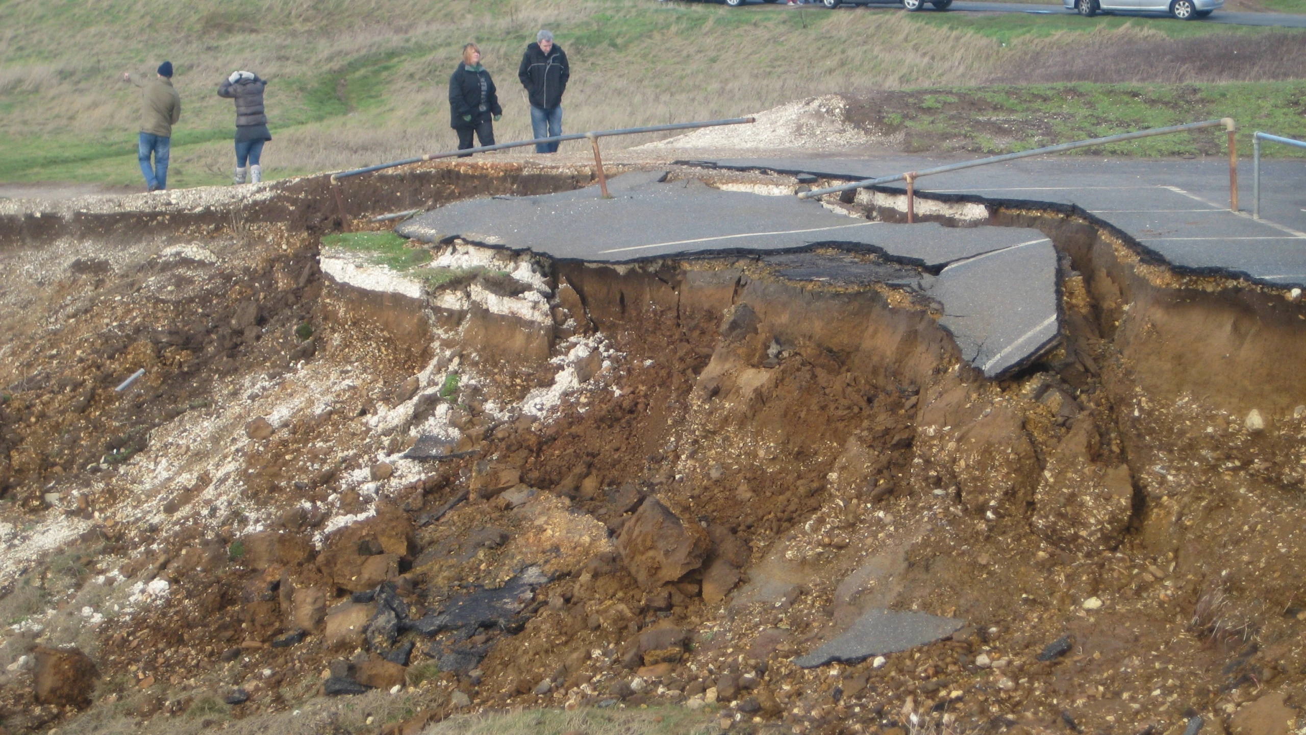 a partially exposed wall is being installed in a hill