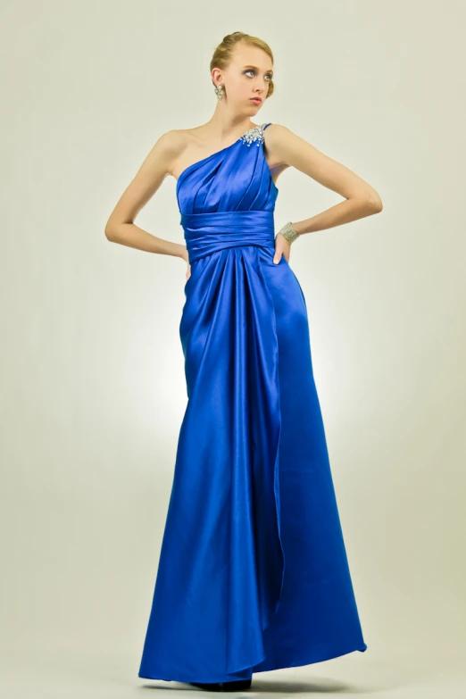 an elegant blue dress with one shoulder tied