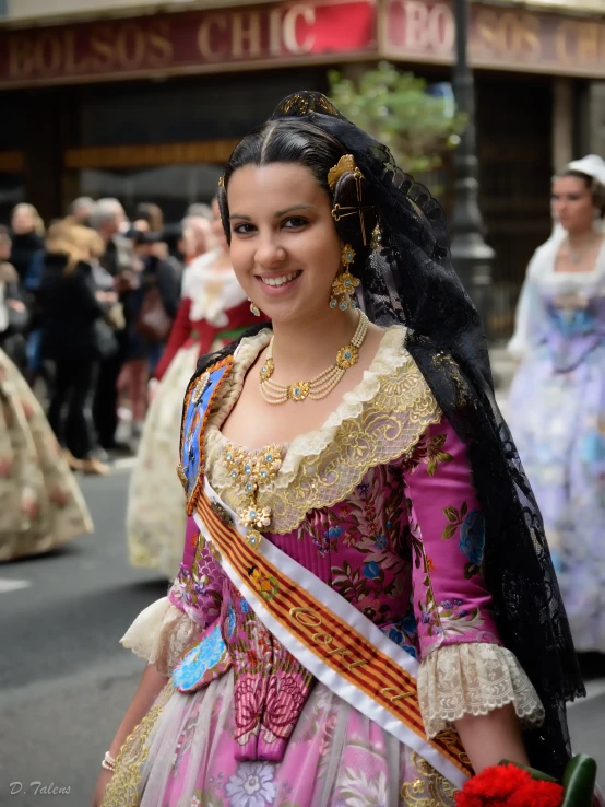 woman wearing dress and tiara walking on a street