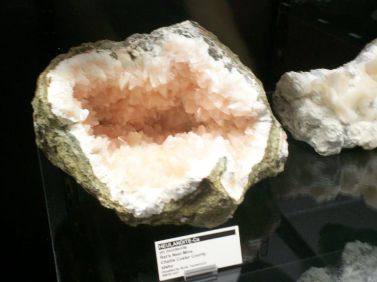 large pieces of rock are displayed in a display case