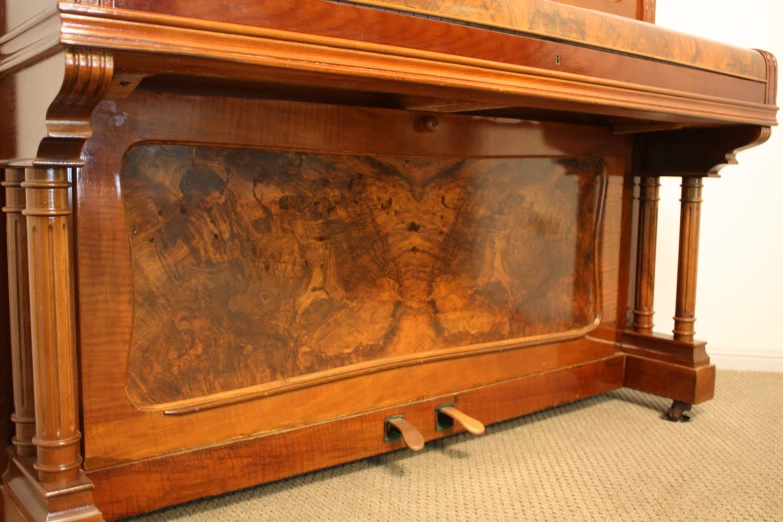 a close up of an ornate wooden bed frame