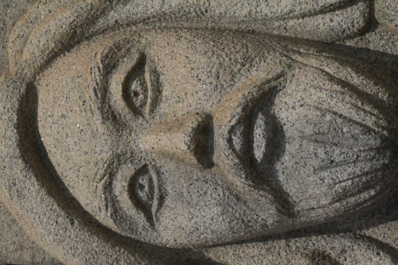 a statue with face on display in the shape of jesus
