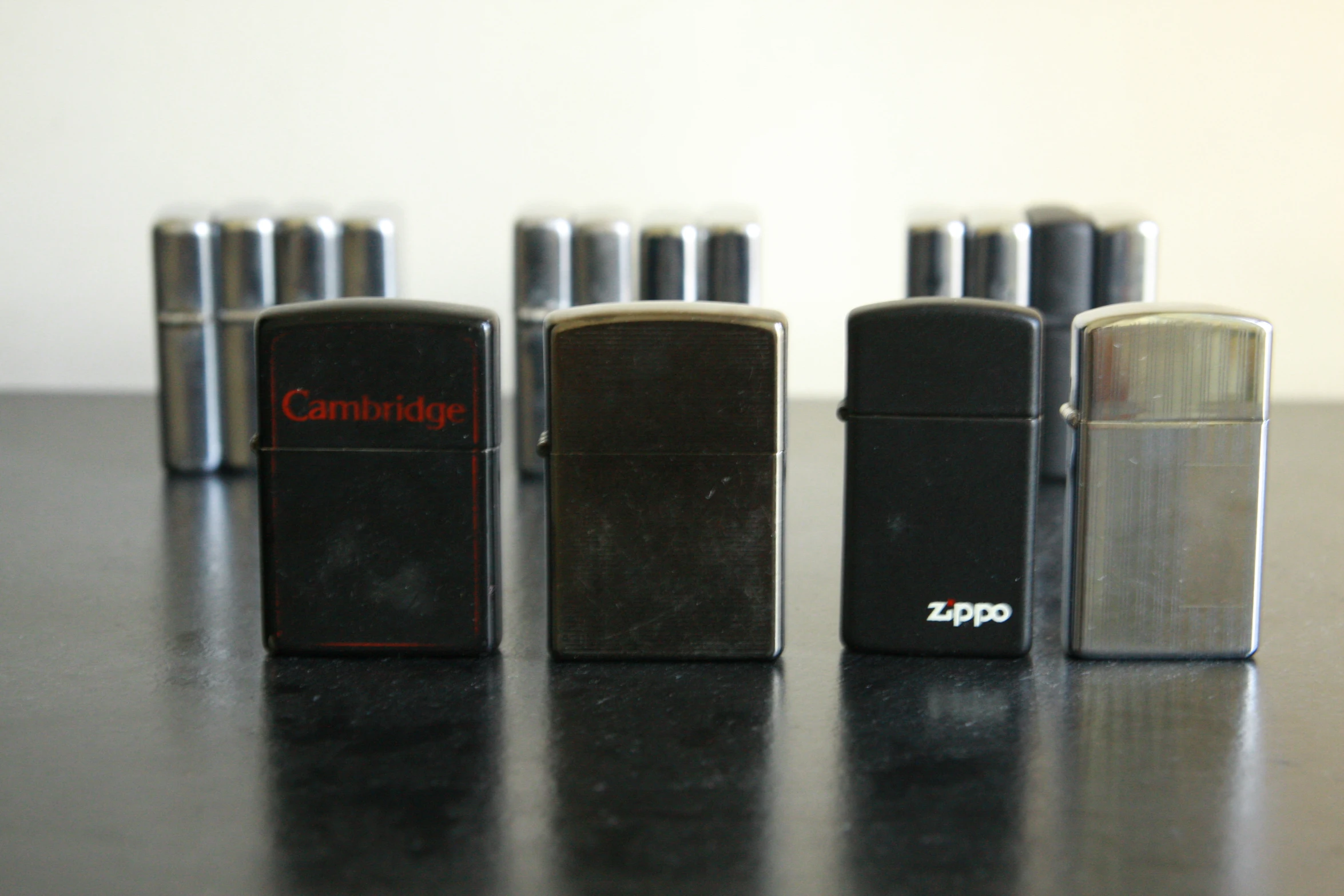 a close up of four electronic devices on a table