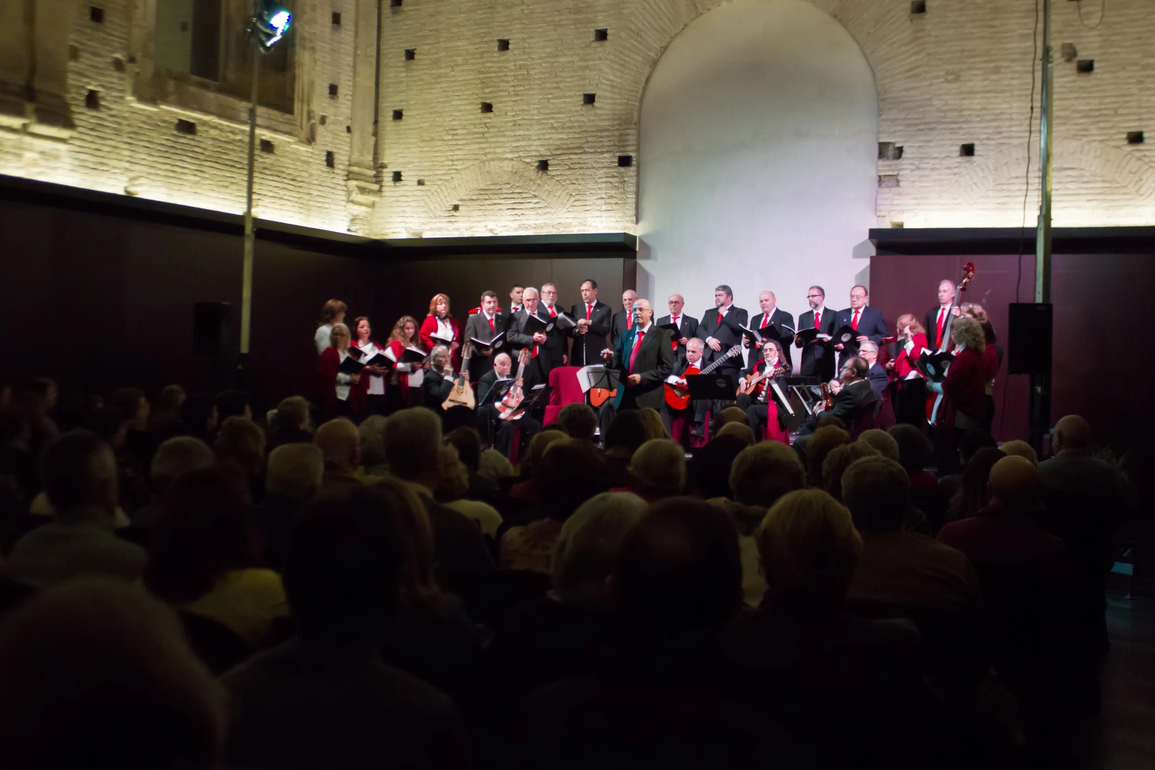 a choir stands in front of the group