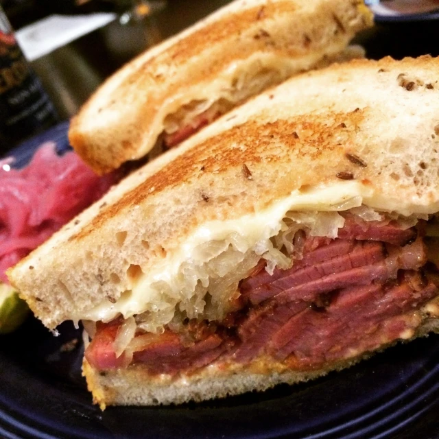 the sandwich has been cut in half on a plate