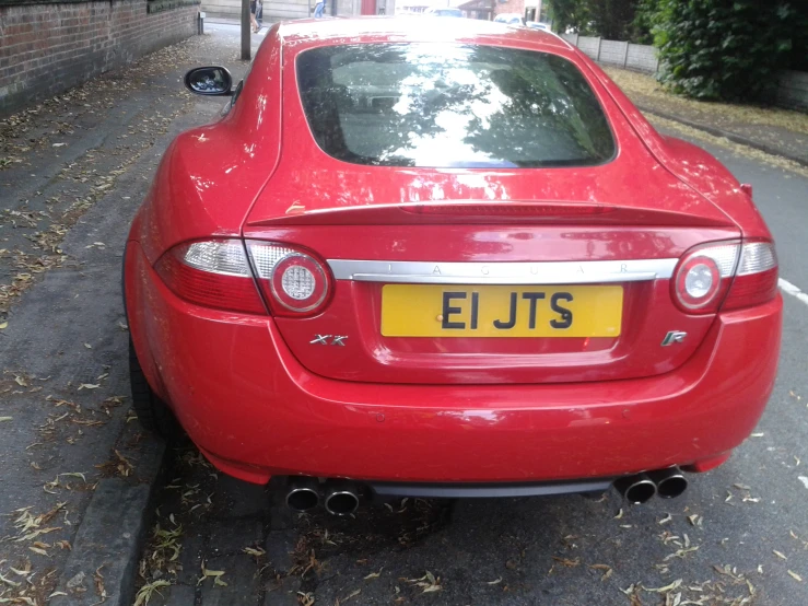 a red car parked on the side of the road