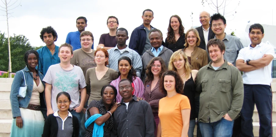 the group of young people are posing for a po