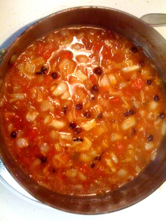 a pot filled with pasta on top of a stove