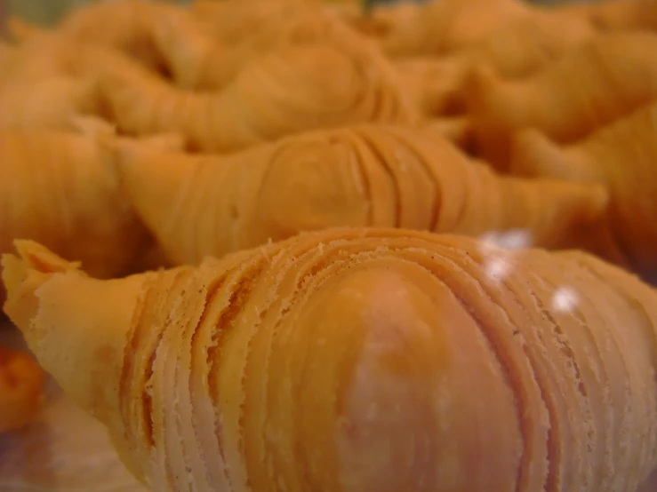 a close up picture of the pastry on display