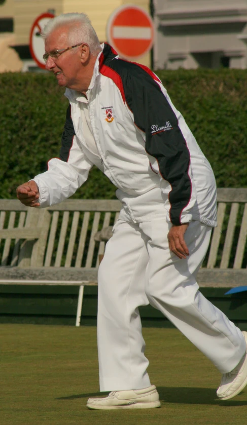 a man in a white and black outfit playing frisbee