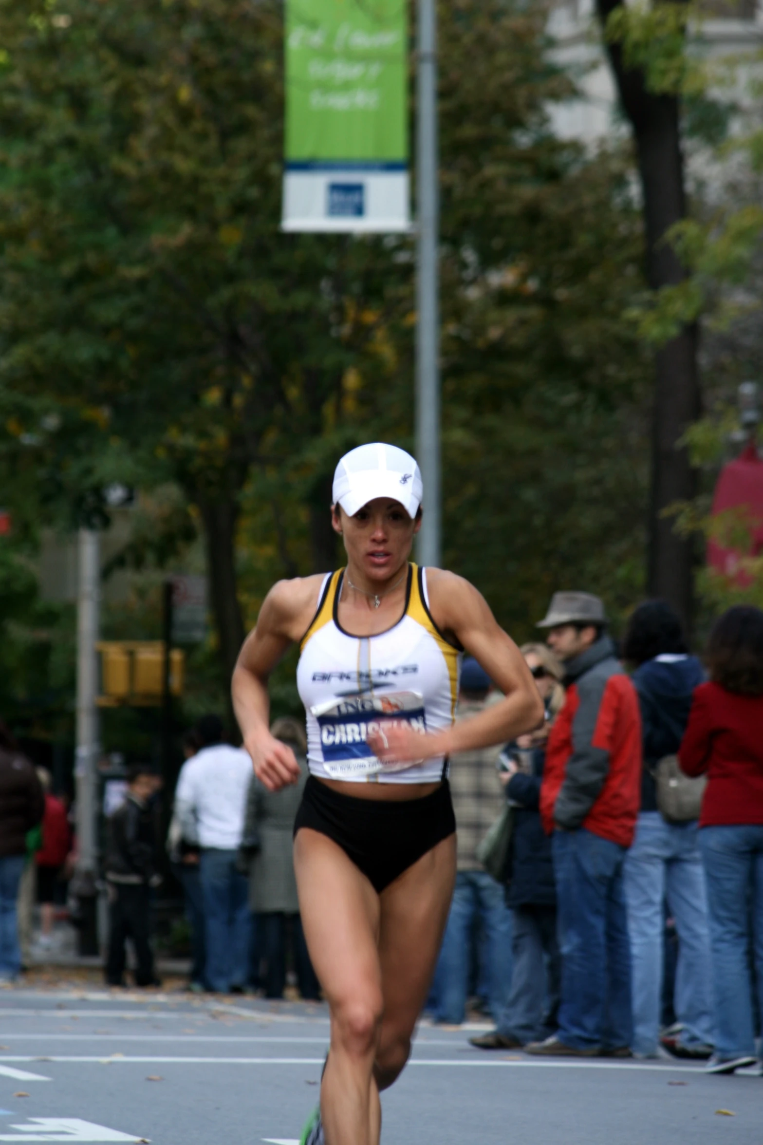 a woman is running while people watch