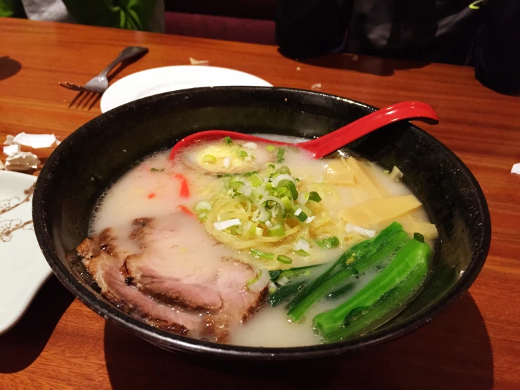 a bowl of soup is sitting on a table