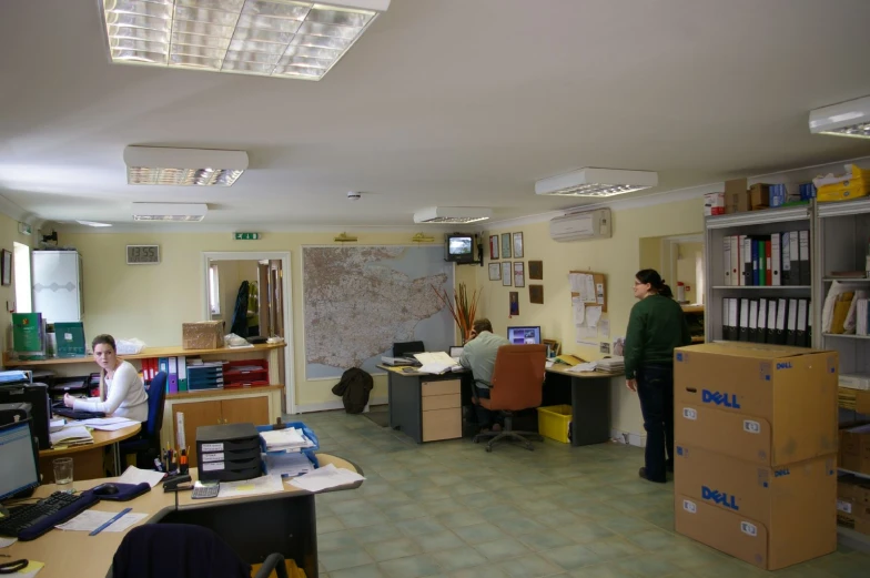 a man works on his computer in an office